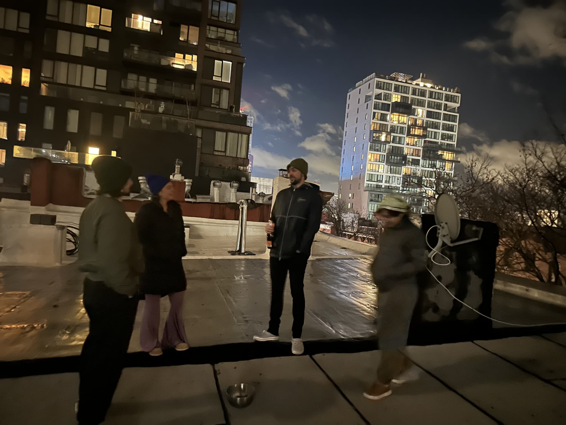 On the rooftop at night, Brooklyn skyline